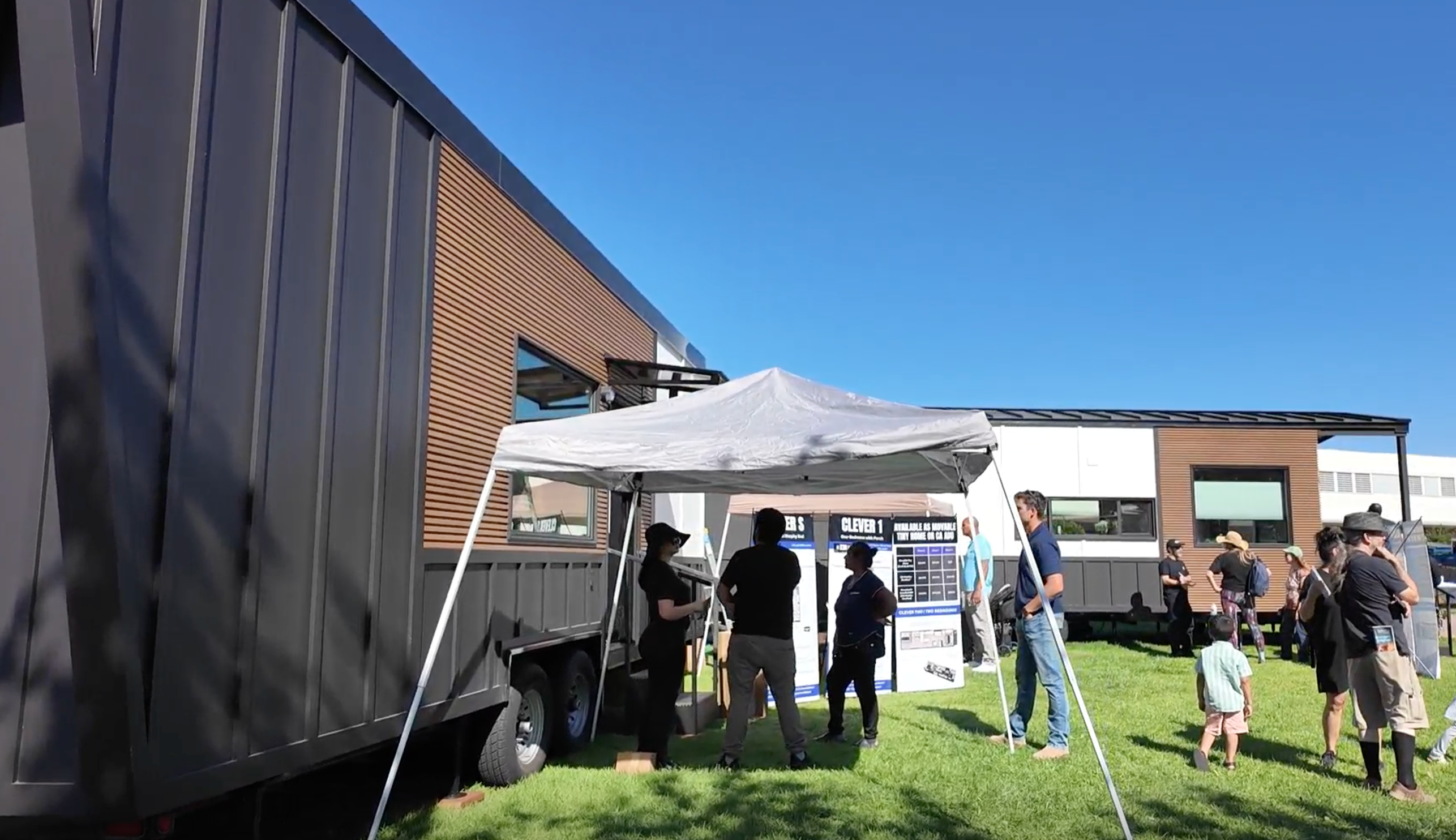 People lining up to view Clever Tiny Homes at a tiny house festival.