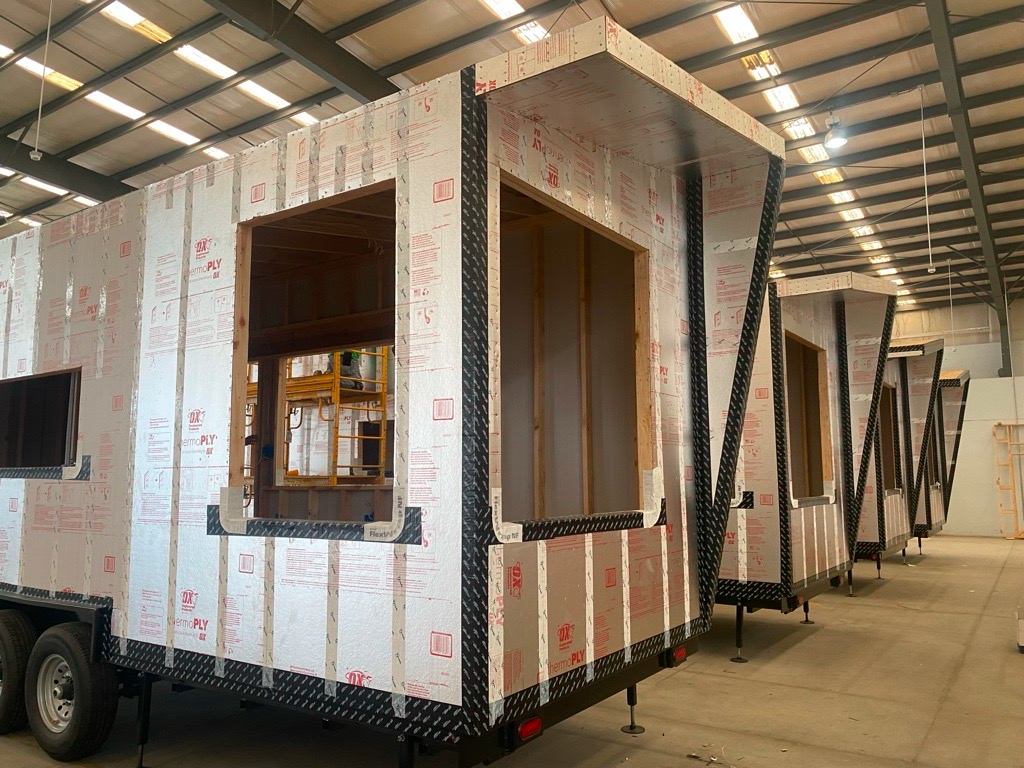 The structural shell of a tiny home studio model.