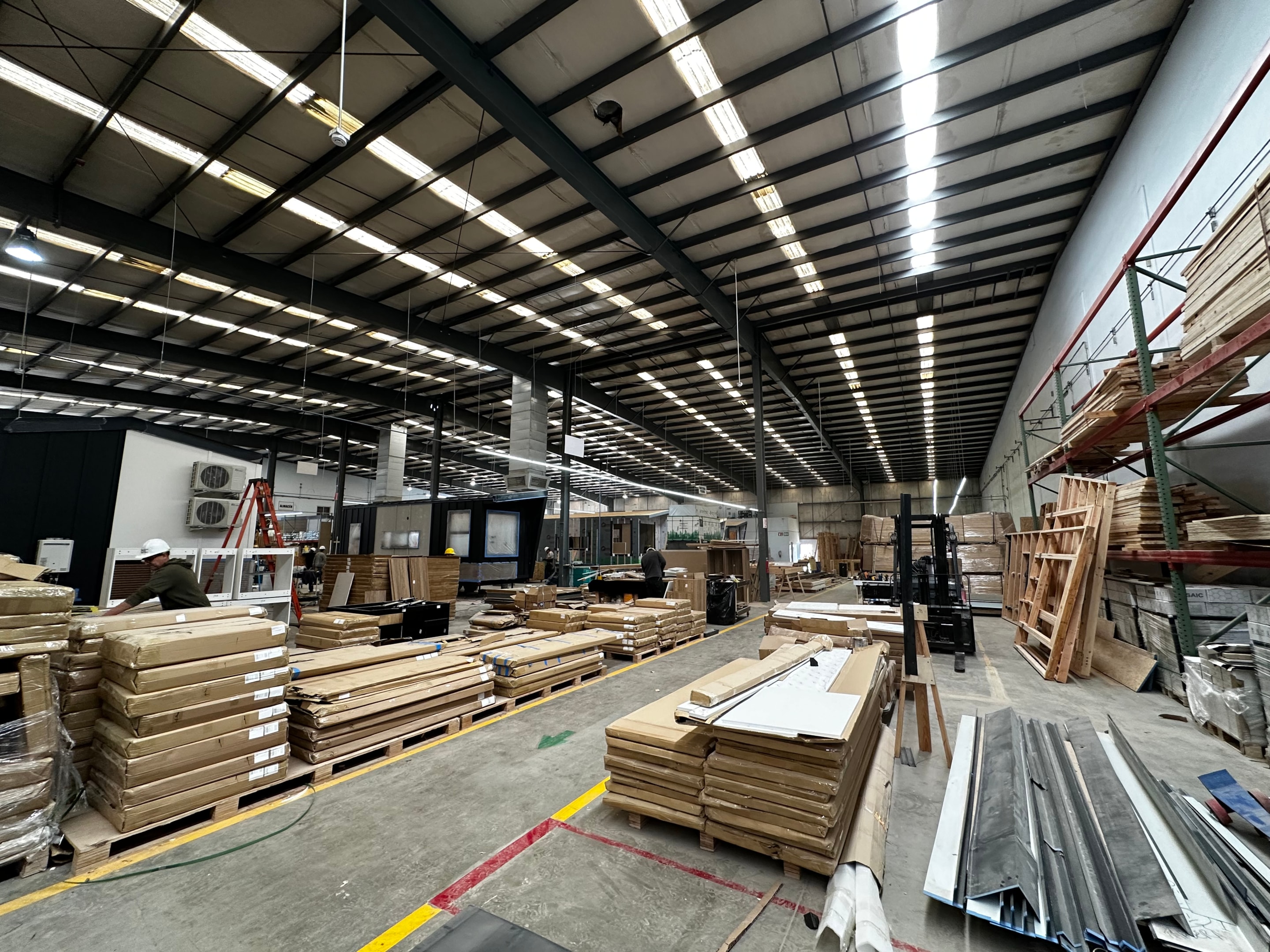 Inventory of construction materials in a big tiny home factory.