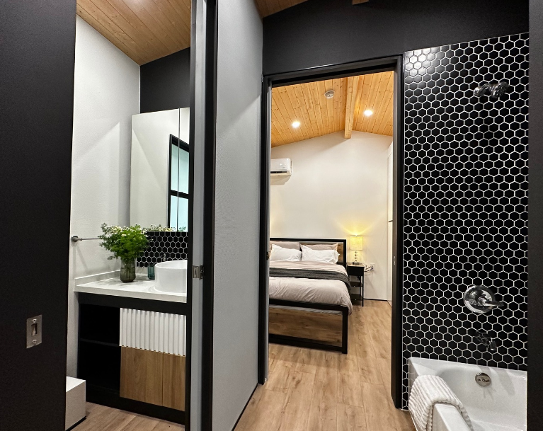 Modern tiny home exterior with clean lines and tall windows.