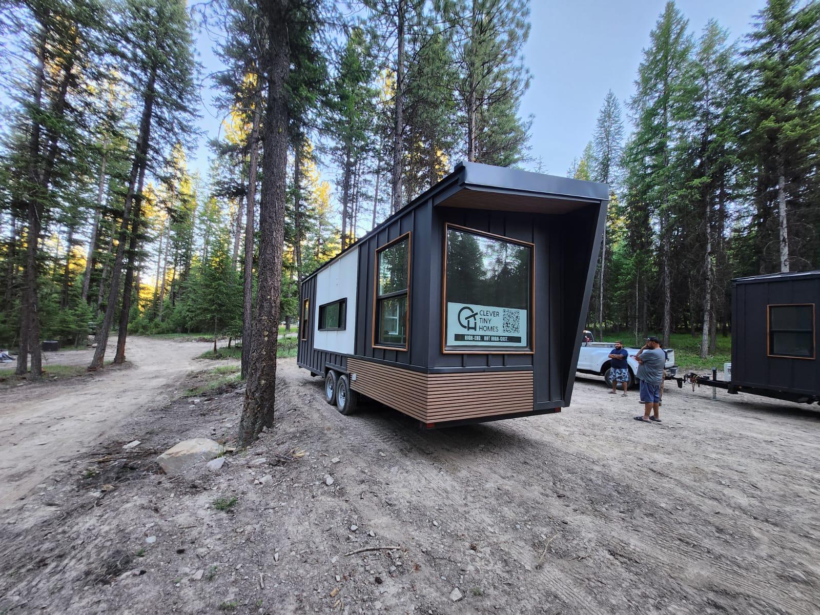 Photo of a Clever tiny house on wheels in the woods