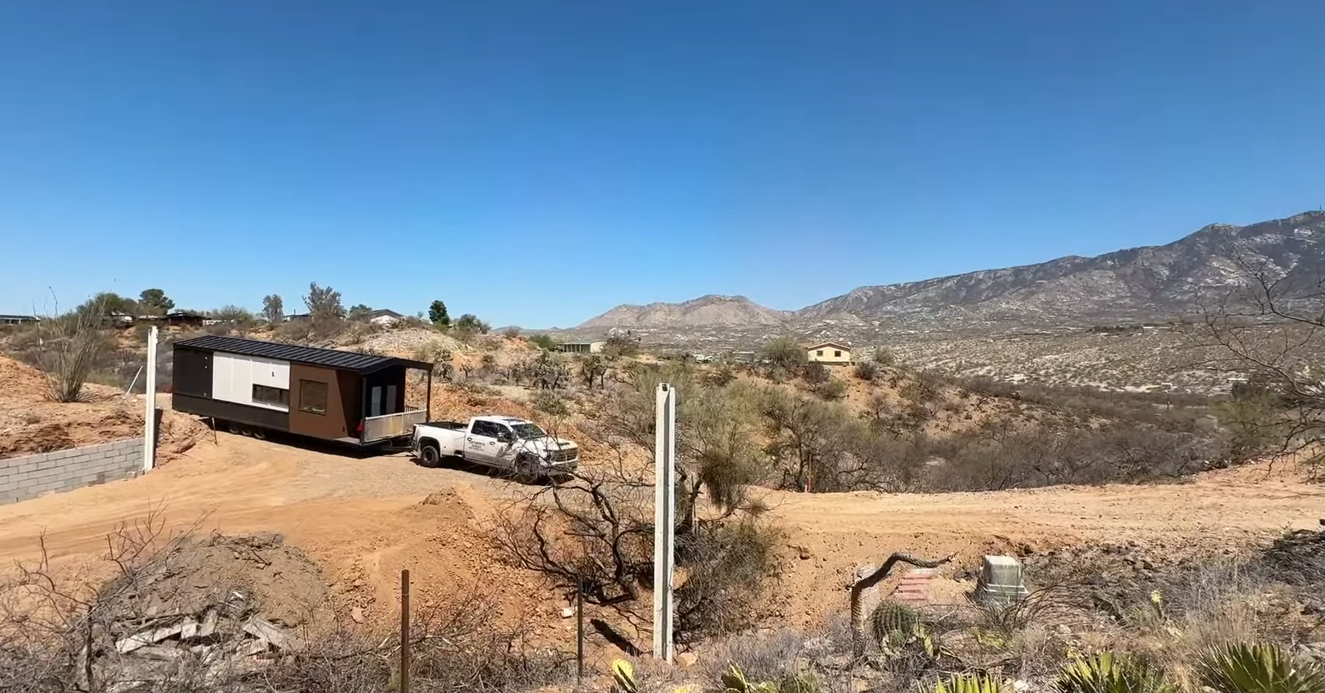 Clever Tiny Home on trailer base, parked on private land, registered as a vehicle.