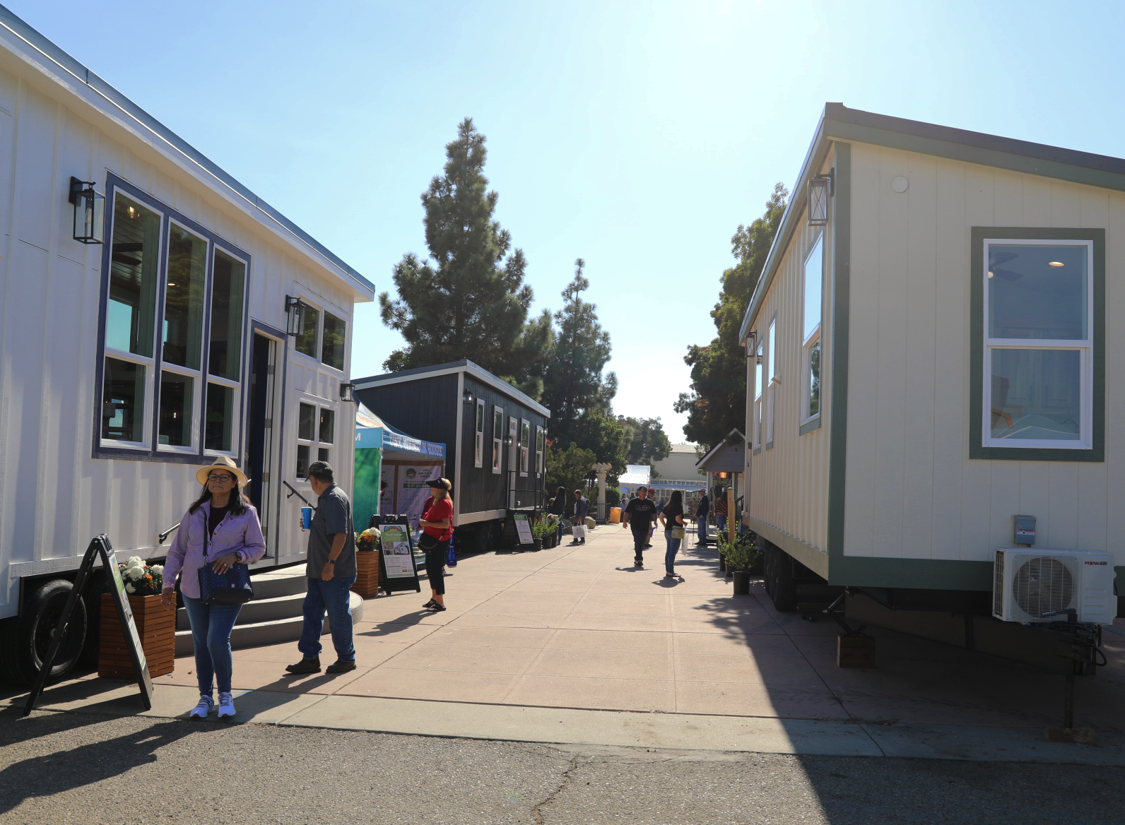 Rows of tiny homes on display before the opening of a tiny house festival in the USA. 