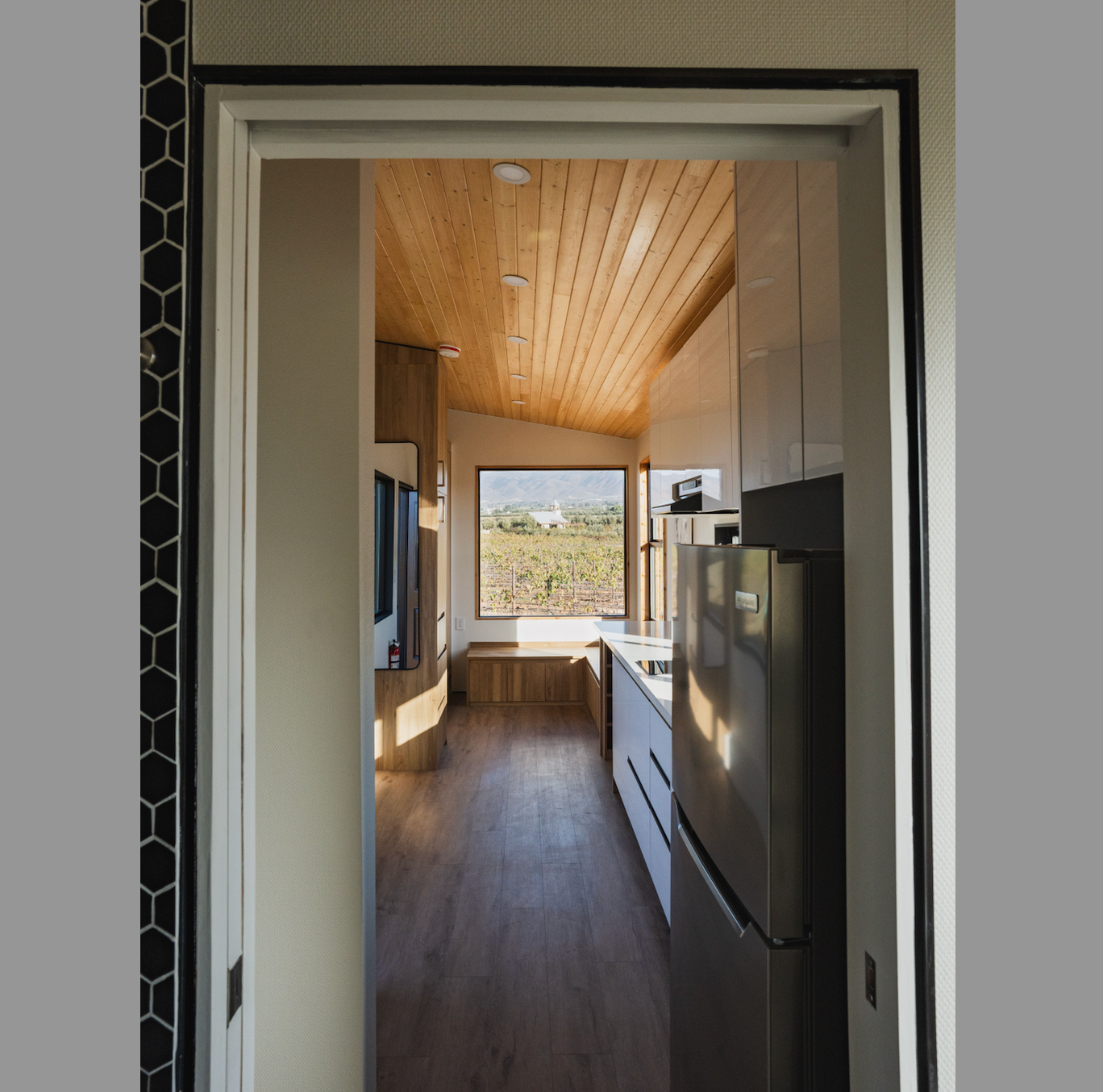 Door frame of a modern tiny home that uses an F Reveal Bead, an alternative to the trim details found in traditional homes and THOWs. 
