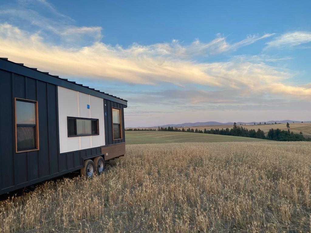 Photo of a customer's Clever Tiny Home on a farm against the backdrop of the sky.