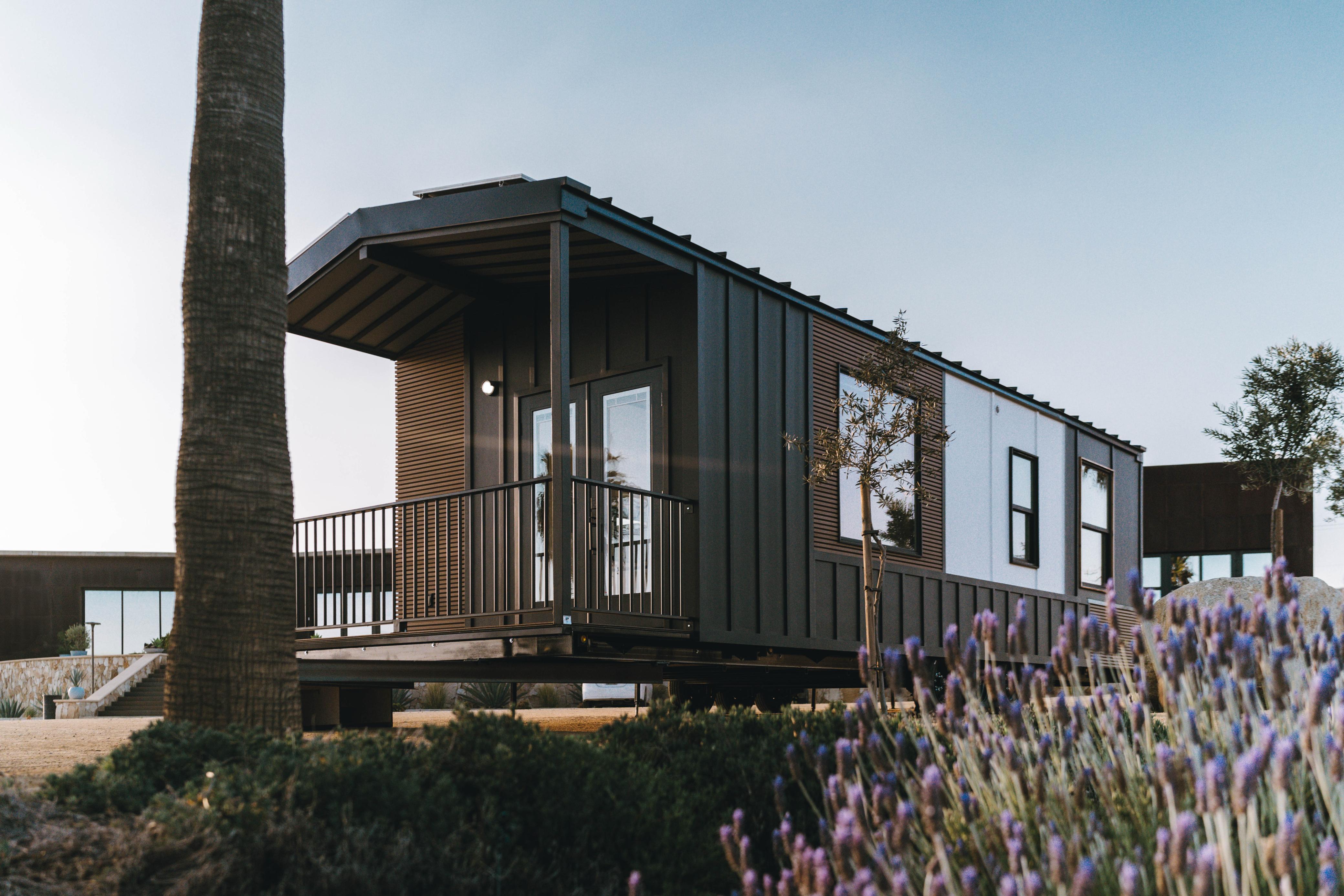 Exterior of a Clever 1 tiny home, showcasing modern siding, large windows, and high-quality construction details that meet residential building codes.