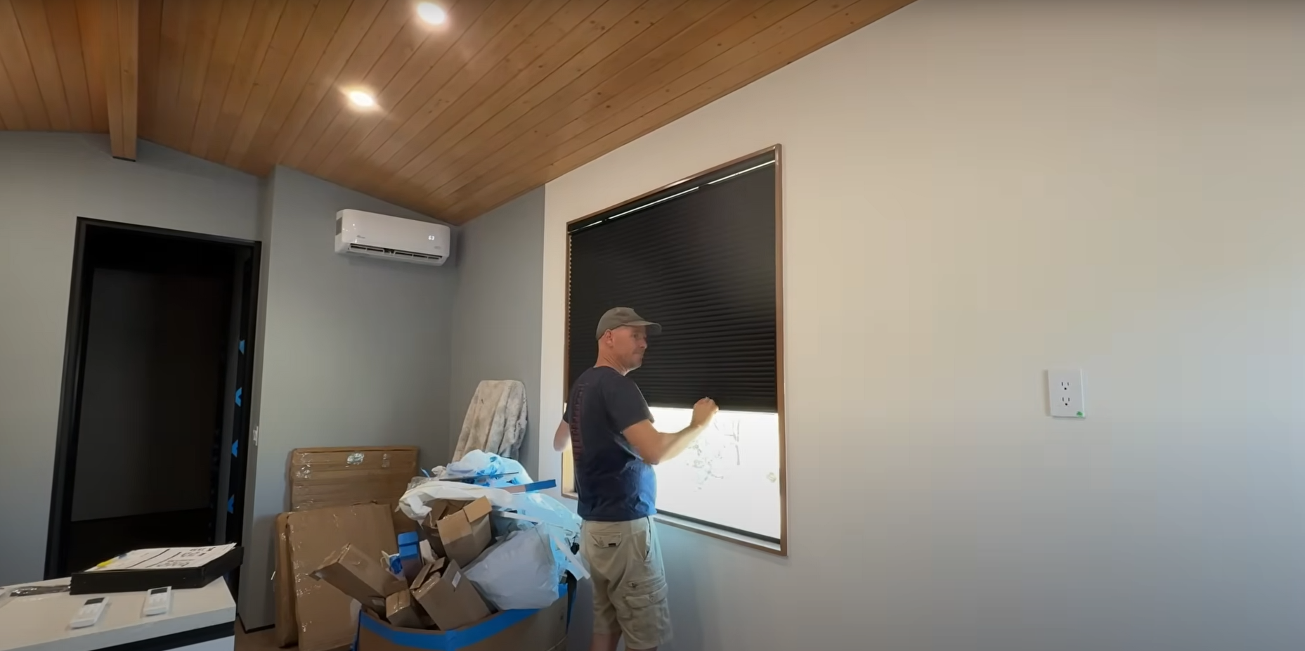Clever 1 owner pulling down his Top Down / Bottom Up cellular shades on his large windowo