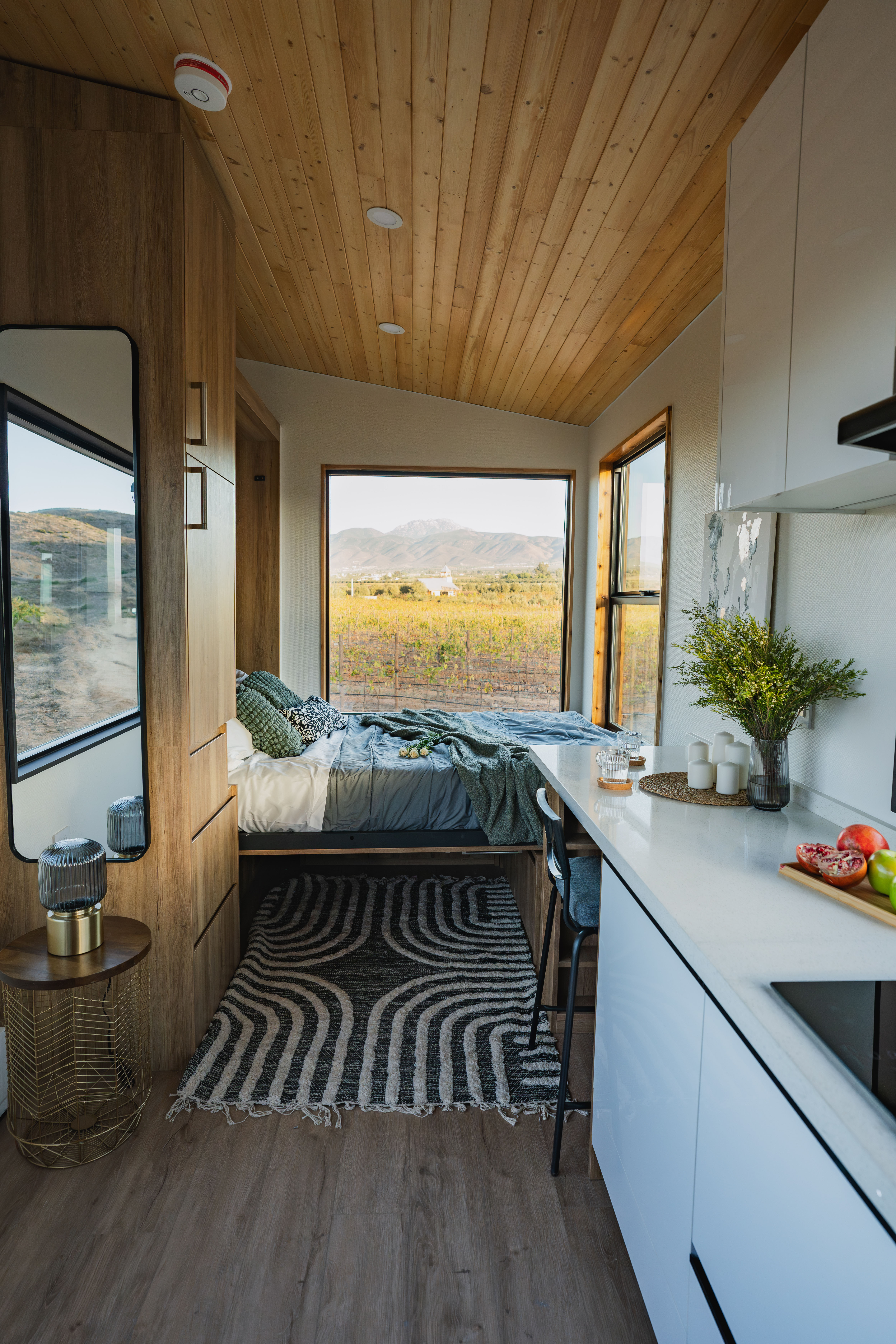 A Clever Tiny Home Studio shows space-saving furniture like a Murphy Bed