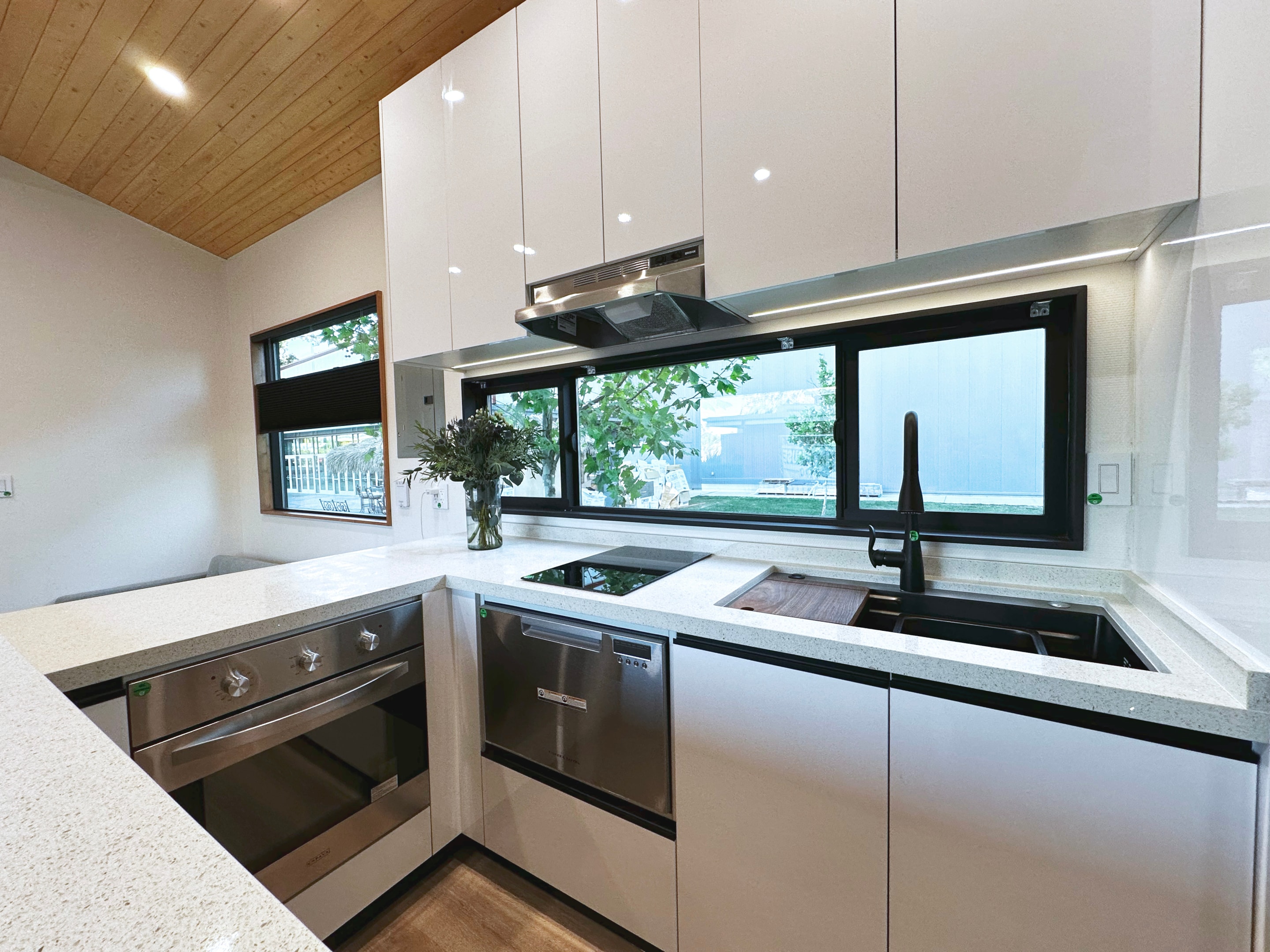 Abundant kitchen storage in a modern tiny home.