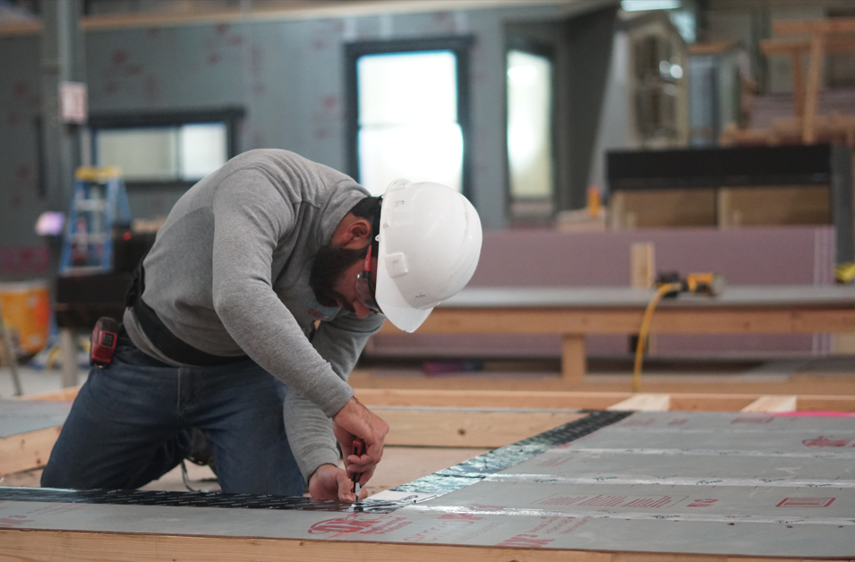 Tiny home plumbing system enclosed inside structure for freeze protection
